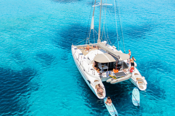 Top sailing destinations in Crete you can visit by boat. The image shows a boat sailing to Mirabello. 