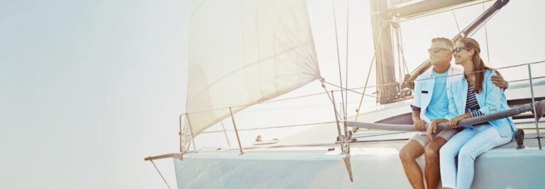 Is a sailing cruise in Crete worth it? Everything you should know. The image shows 2 persons enjoy sailing (freepik.com)